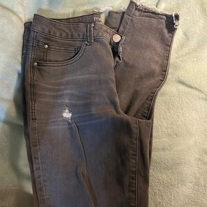 Grey distressed skinny jeans